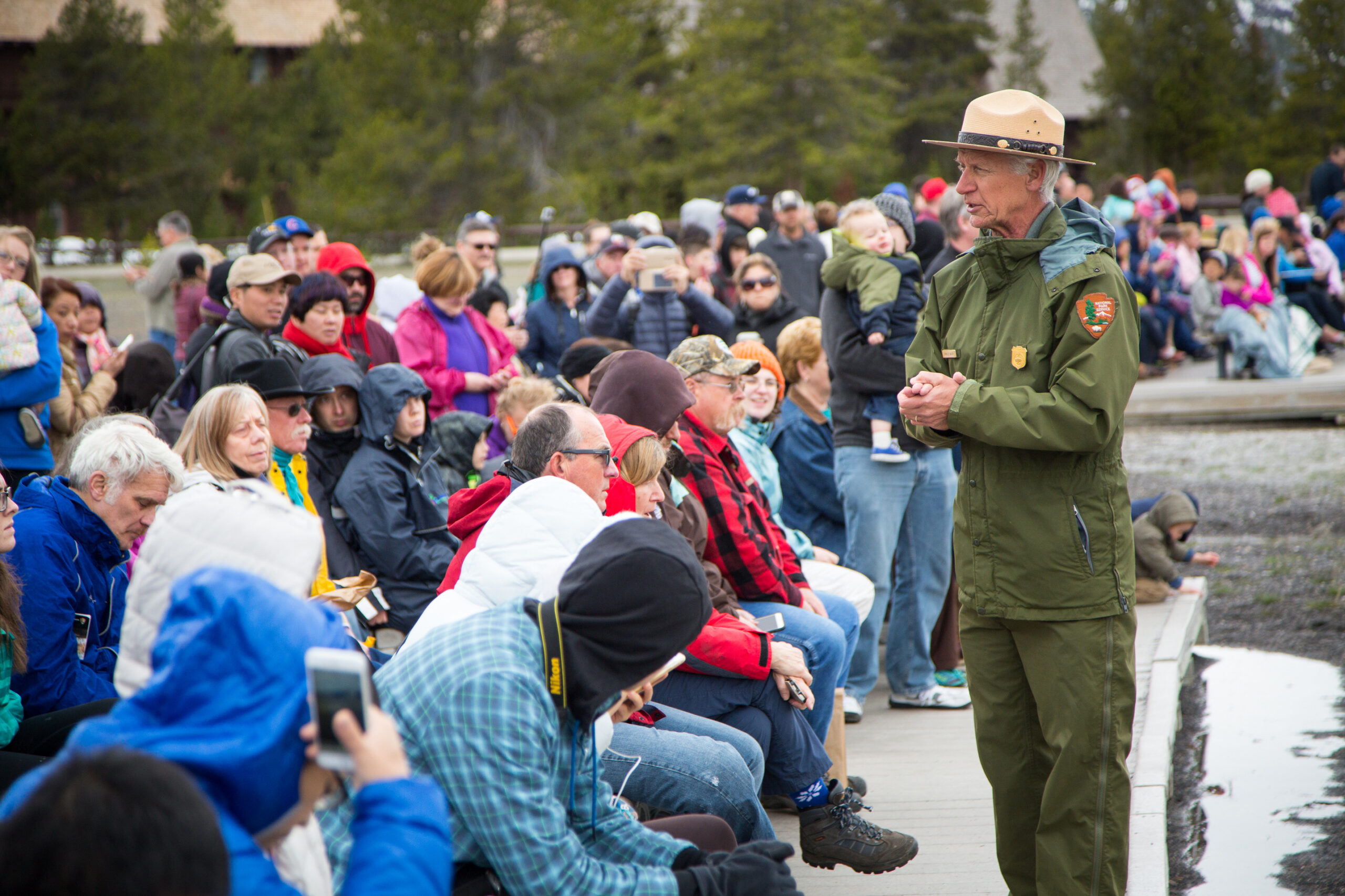 Interpretive program, lead by Butch Bach, at Old Faithful;
Neal Herbert;
April 2016;
Catalog #20608d;
Original #ndh-yell-8842